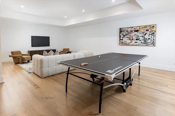 a living room with a table and a flat screen tv