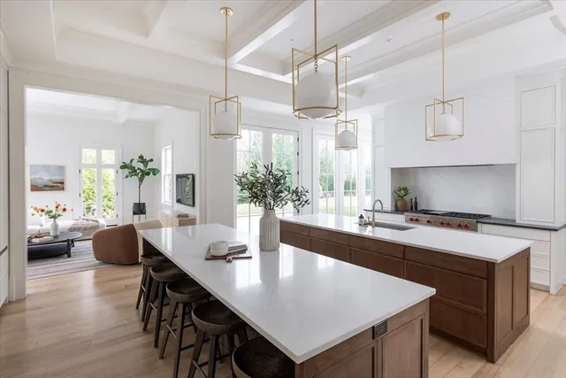 a large kitchen with a table and chairs