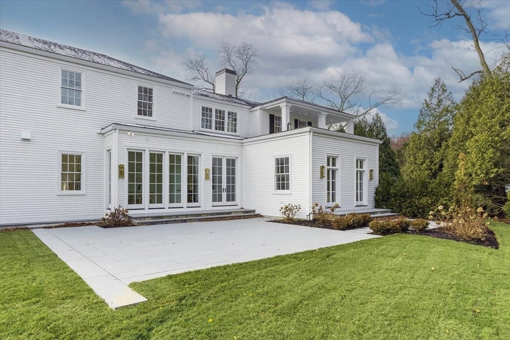 222 Warren Street Brookline, MA 02445 - Photo 33 of 33 a front view of a house with a garden