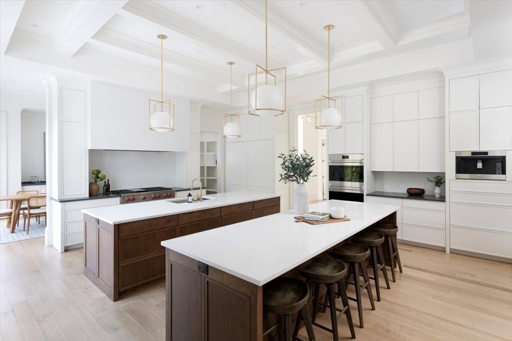 222 Warren Street Brookline, MA 02445 - Photo 5 of 33 a kitchen that has a table and chairs in it