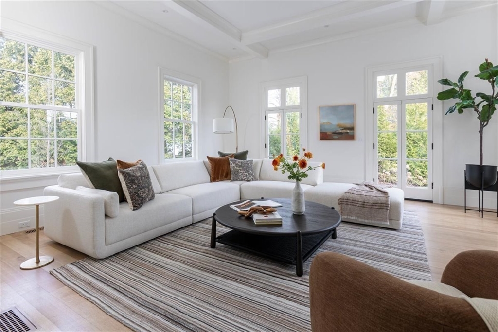 222 Warren Street Brookline, MA 02445 - Photo 6 of 33 a living room with furniture and a large window