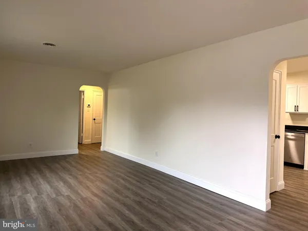 a view of livingroom with hardwood floor and a sink