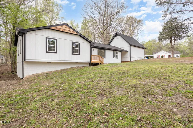 a house with trees in front of it