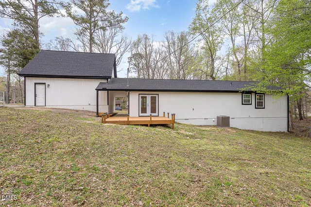 a house that has a tree in front of it
