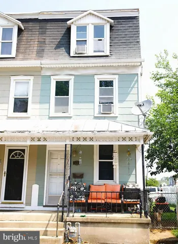 a view of a building with car parked