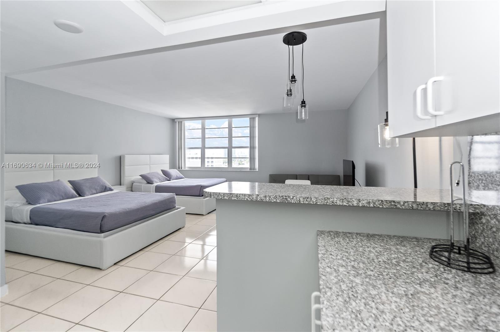 100 Lincoln Road, Unit 1016 Miami Beach, FL 33139 - Photo 11 of 25 a living room with furniture and a table