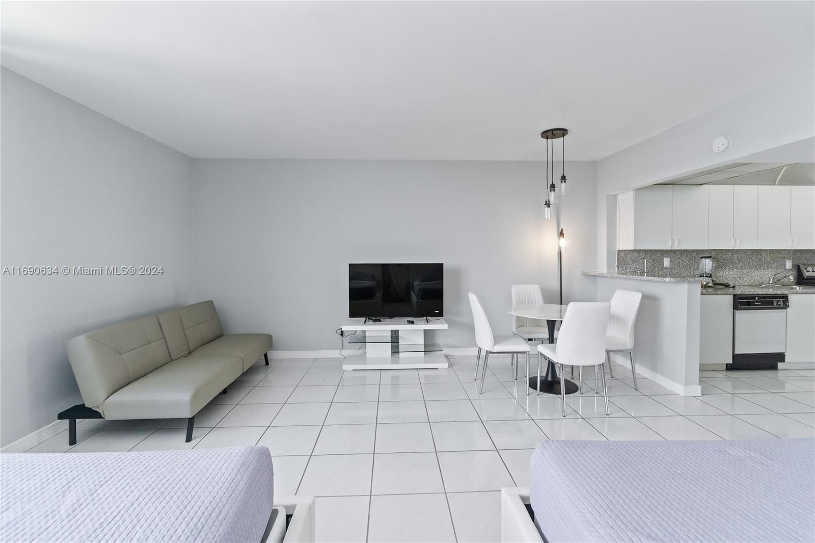100 Lincoln Road, Unit 1016 Miami Beach, FL 33139 - Photo 3 of 25 a living room with furniture and a flat screen tv