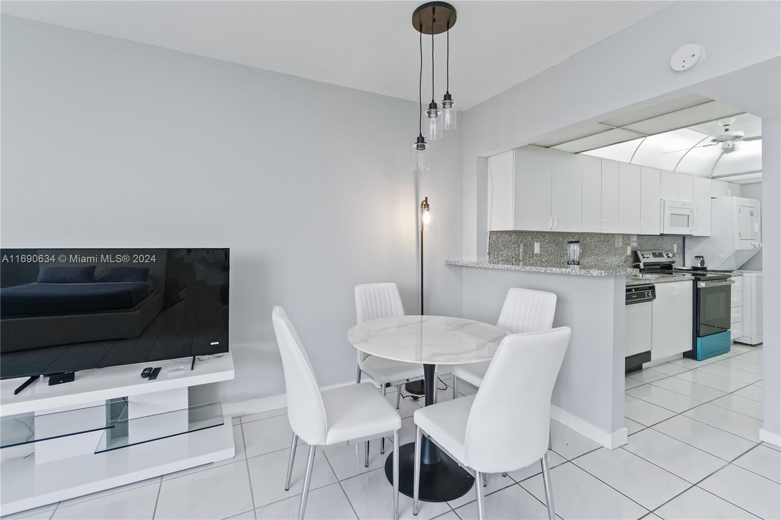 100 Lincoln Road, Unit 1016 Miami Beach, FL 33139 - Photo 8 of 25 a view of kitchen with cabinets
