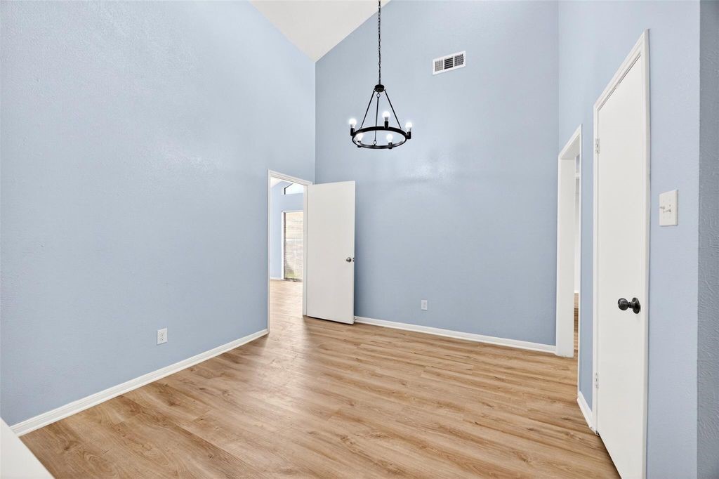 17 April Point Drive North Conroe, TX 77356 - Photo 34 of 42 a view of an empty room with wooden floor