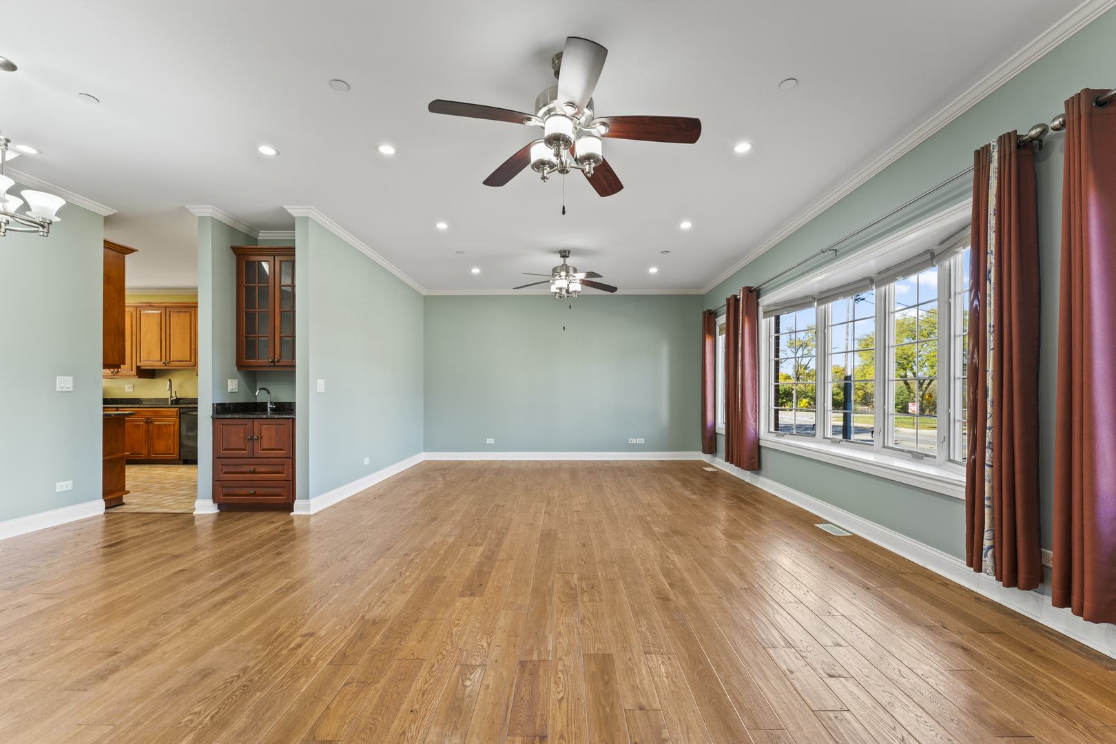 5533 Lincoln Avenue Morton Grove, IL 60053 - Photo 2 of 40 an empty room with wooden floor and windows