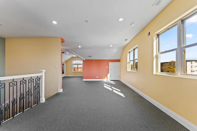 a view of a hallway with windows