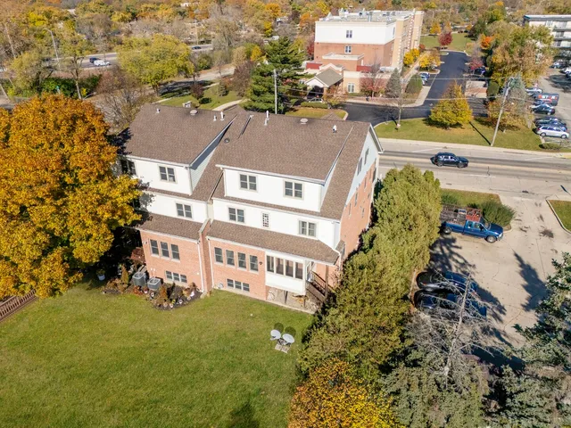 an aerial view of a house with a garden
