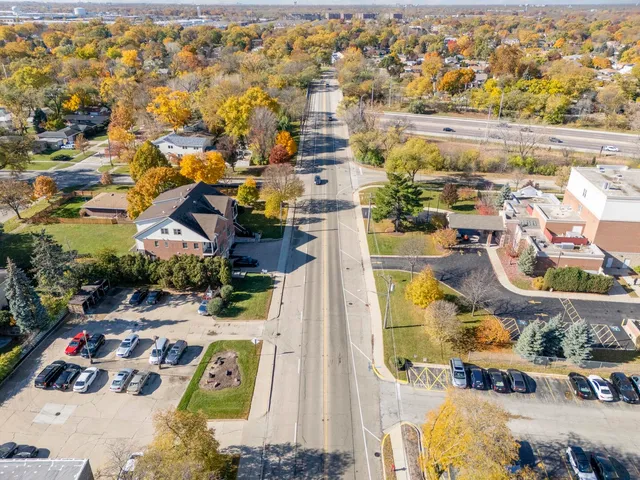 an aerial view of residential houses with outdoor space