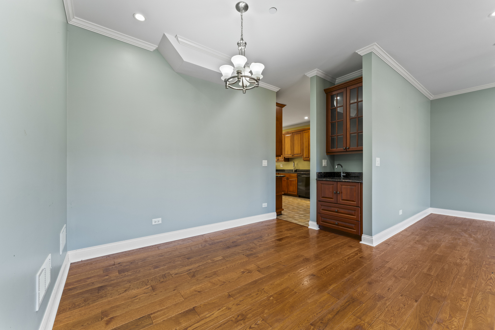 5533 Lincoln Avenue Morton Grove, IL 60053 - Photo 4 of 40 a view of empty room with wooden floor