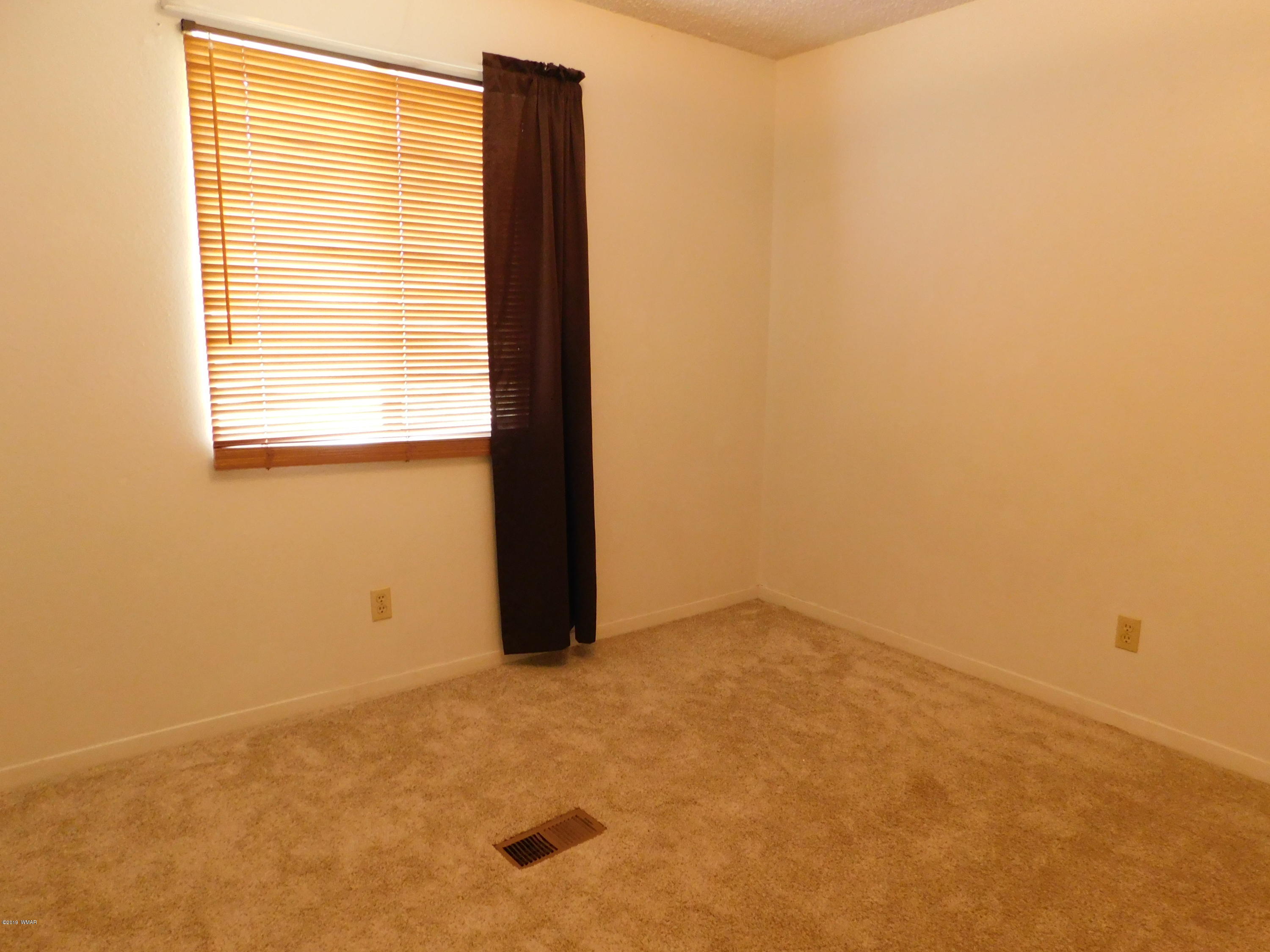 353 Brant Street Eagar, AZ 85925 - Photo 14 of 23 a view of an empty room with a window