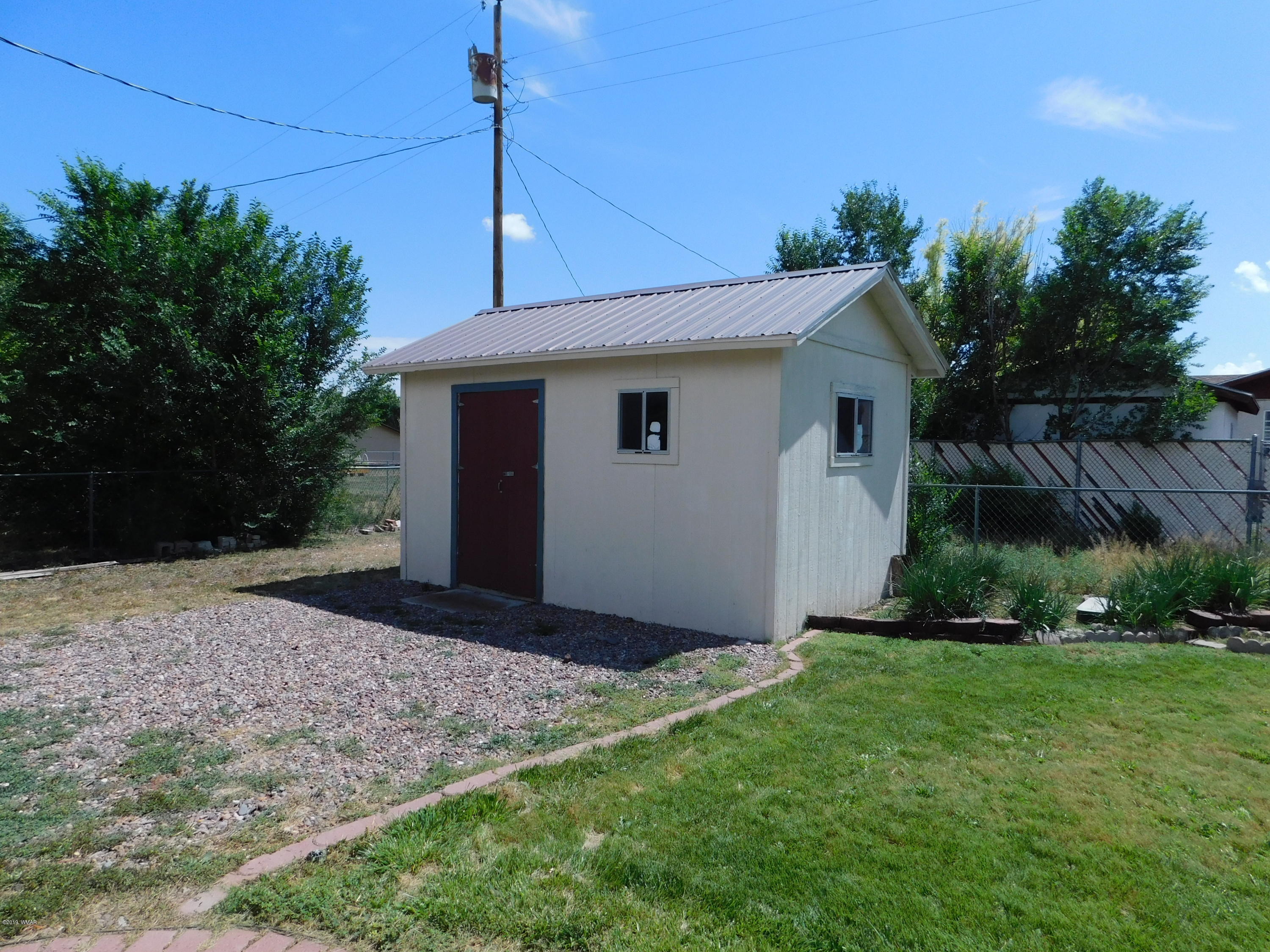 353 Brant Street Eagar, AZ 85925 - Photo 20 of 23 a view of a house with a yard