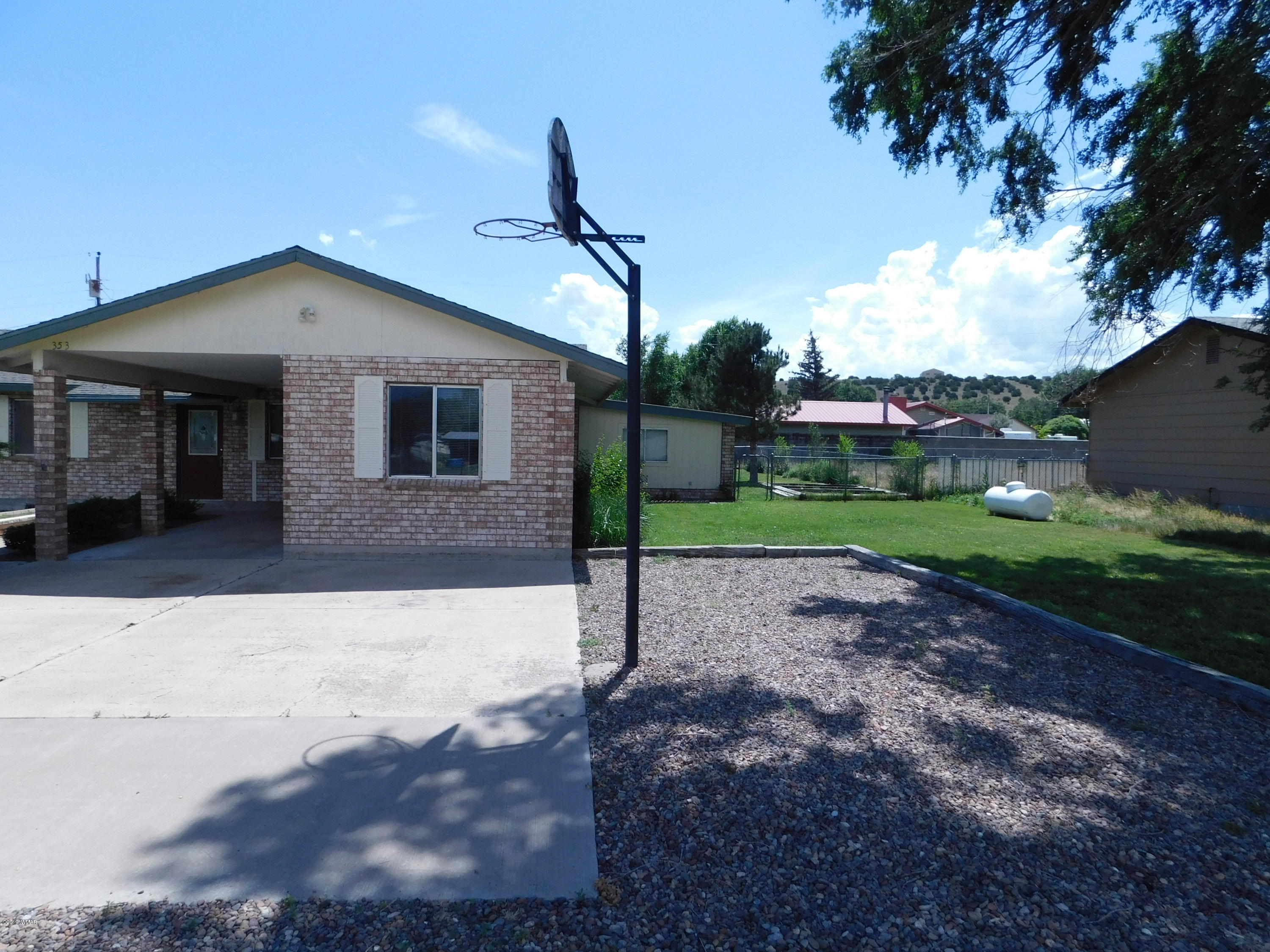353 Brant Street Eagar, AZ 85925 - Photo 2 of 23 a front view of a house with a yard