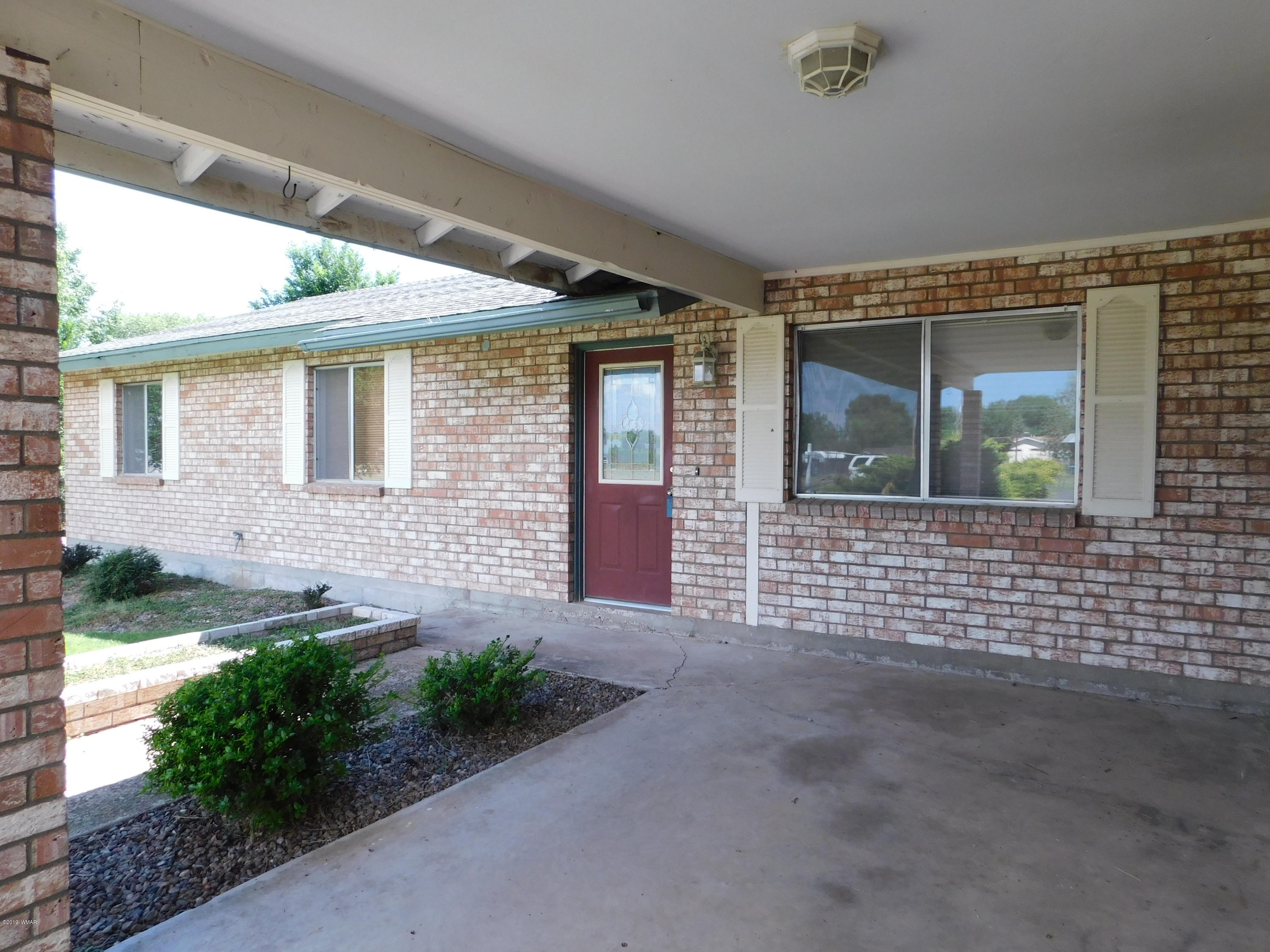 353 Brant Street Eagar, AZ 85925 - Photo 3 of 23 a front view of a house with garden