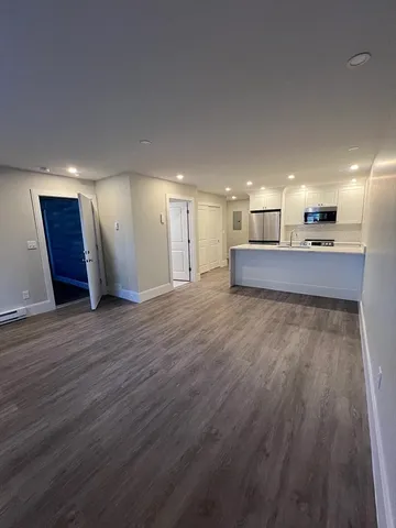 a view of a kitchen with a sink and a stove