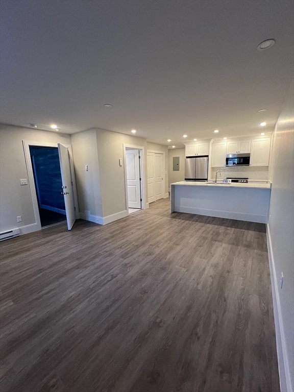 17 Carson Street, Unit 6C Boston, MA 02125 - Photo 2 of 11 a view of a kitchen with a sink and a stove