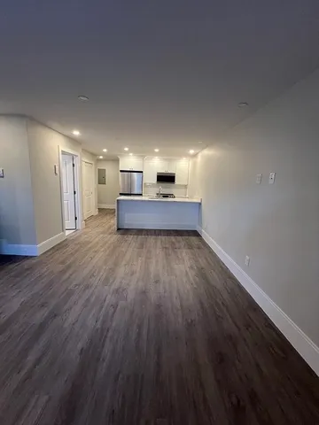 a living room with a wooden floor