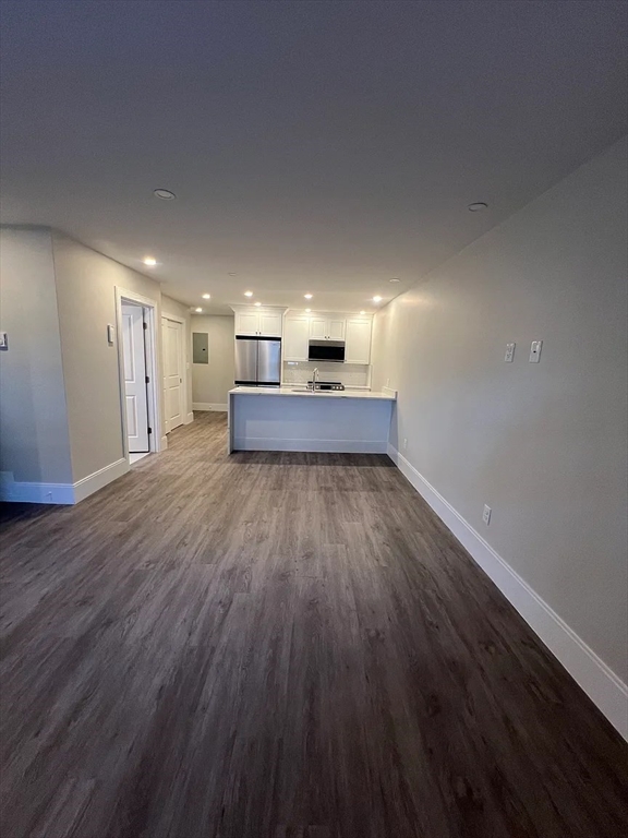 17 Carson Street, Unit 6C Boston, MA 02125 - Photo 3 of 11 a living room with a wooden floor