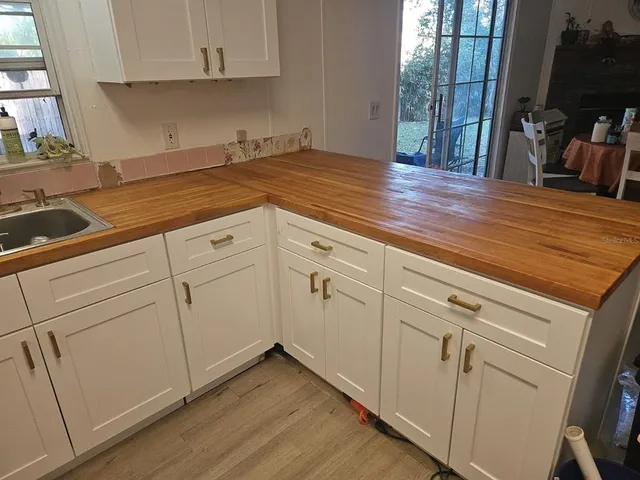 a view of a kitchen with cabinets