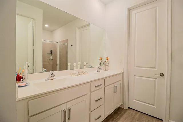 a bathroom with a sink and a mirror