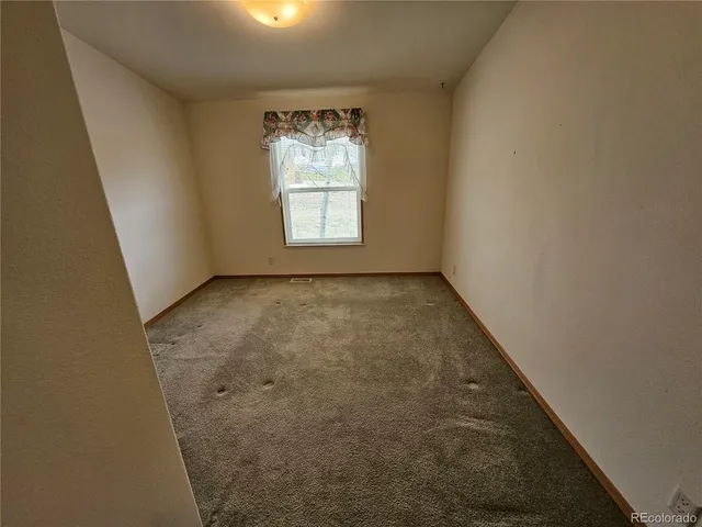 an empty room with a window