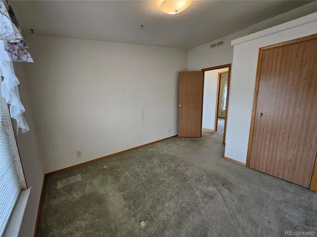 an empty room with closet