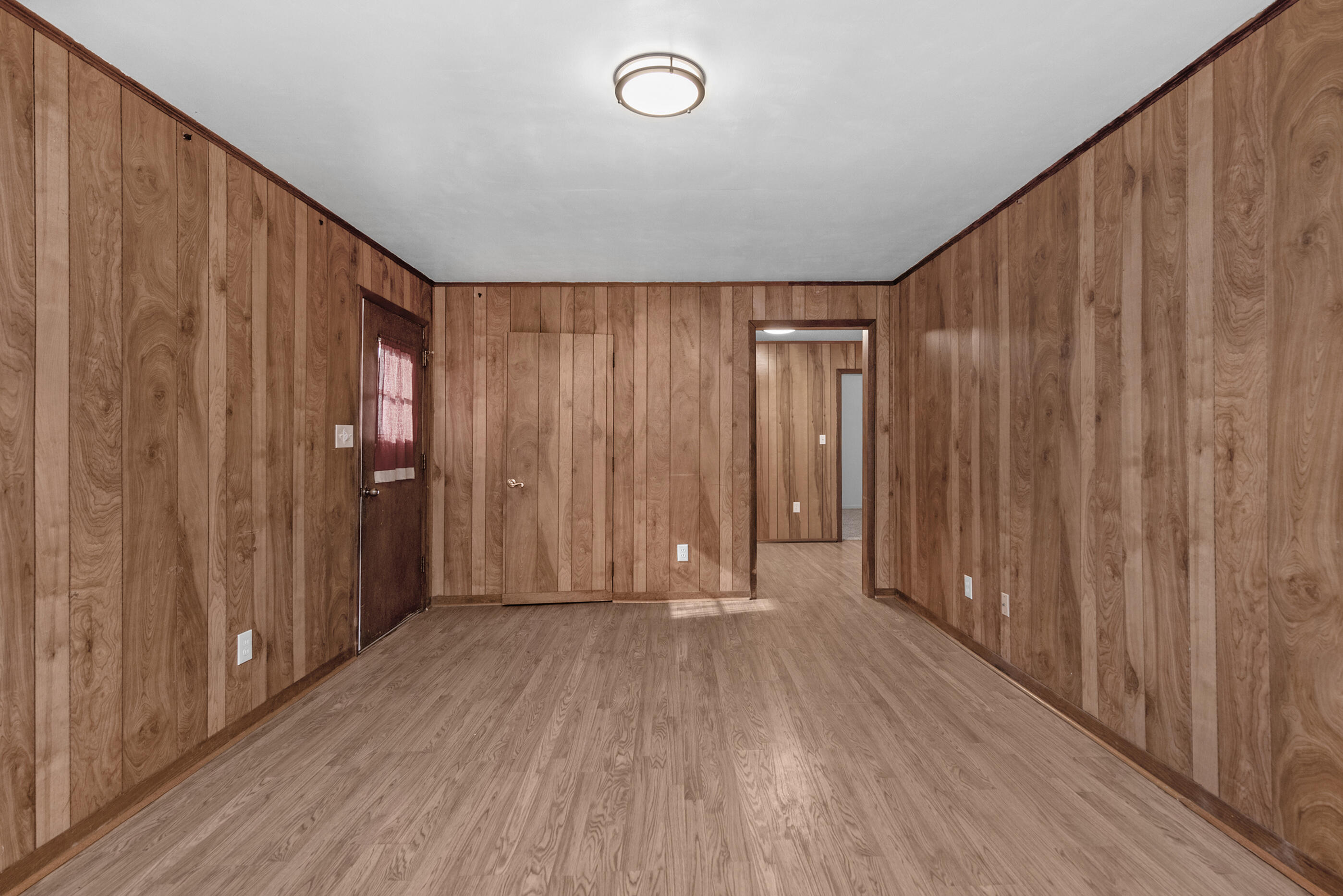 235 Deluna Road Southwest Fort Walton Beach, FL 32548 - Photo 13 of 29 a view of a hallway with wooden floor