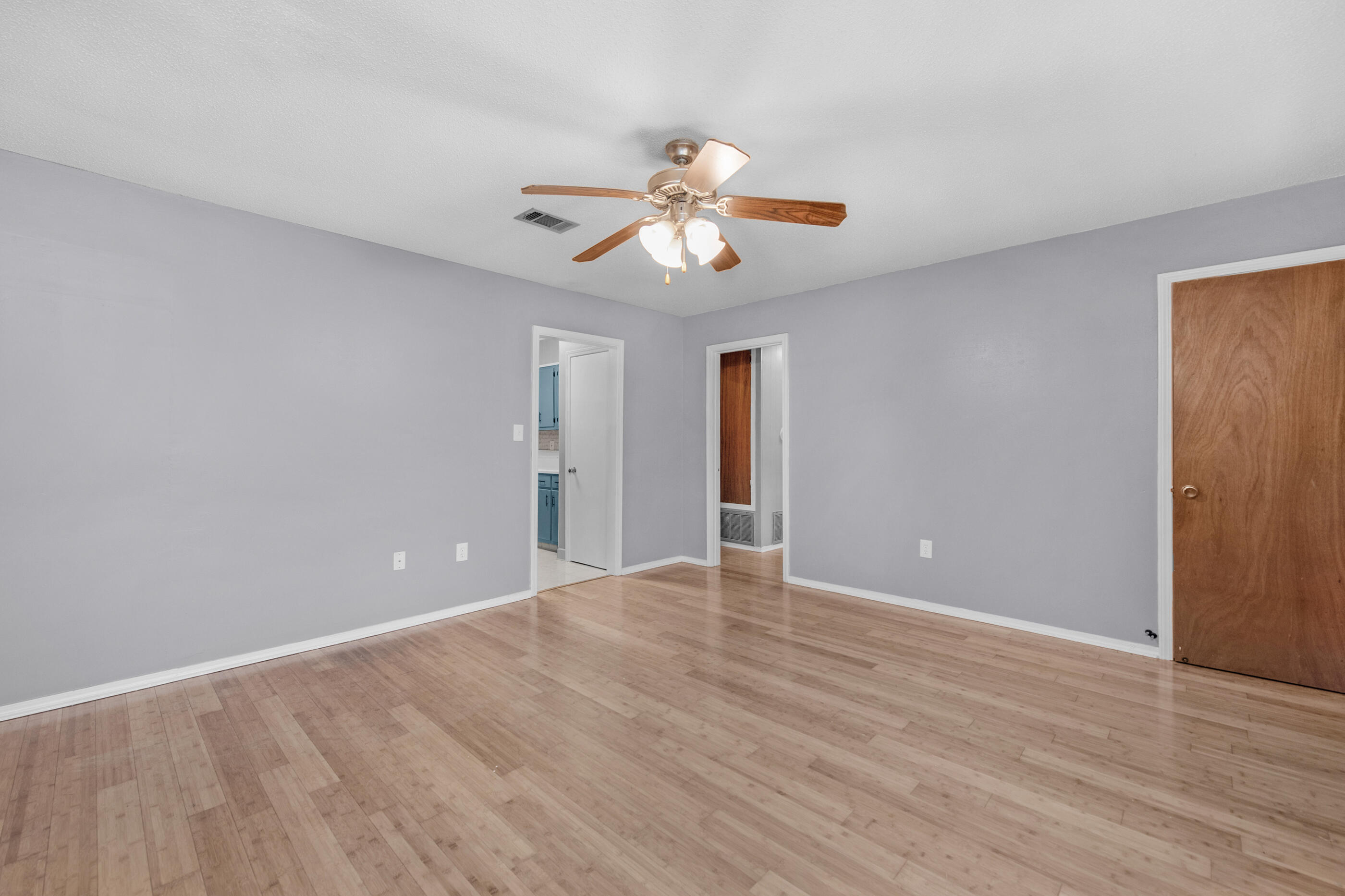 235 Deluna Road Southwest Fort Walton Beach, FL 32548 - Photo 16 of 29 a view of an empty room with window and wooden floor