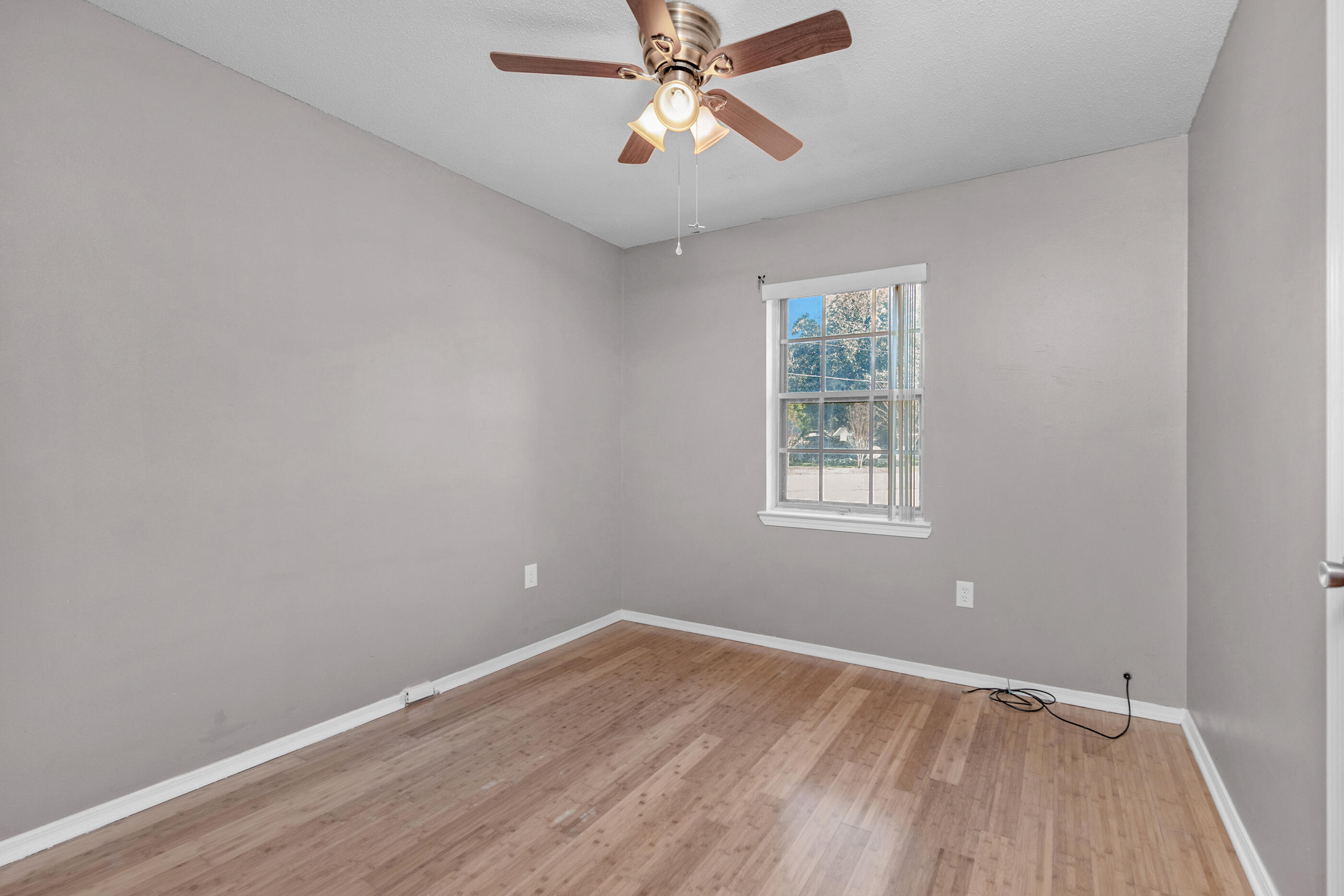 235 Deluna Road Southwest Fort Walton Beach, FL 32548 - Photo 18 of 29 wooden floor in an empty room with a window