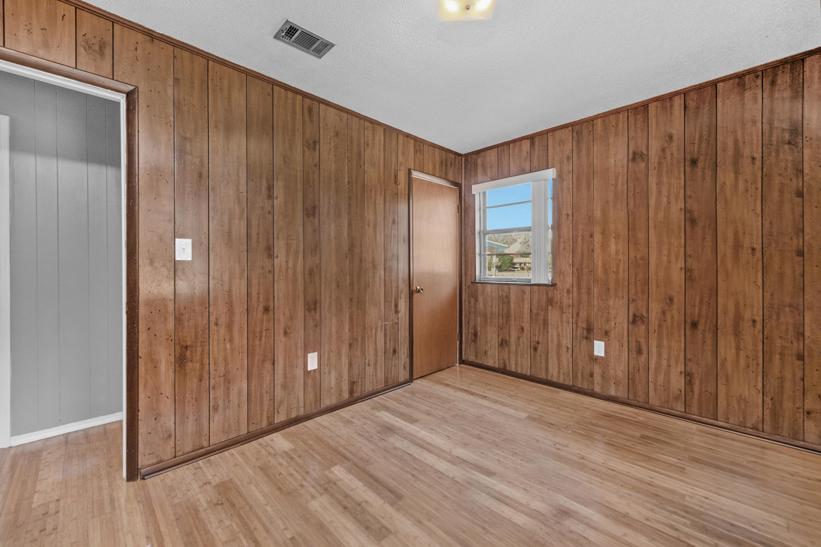 235 Deluna Road Southwest Fort Walton Beach, FL 32548 - Photo 20 of 29 a view of an empty room with wooden floor