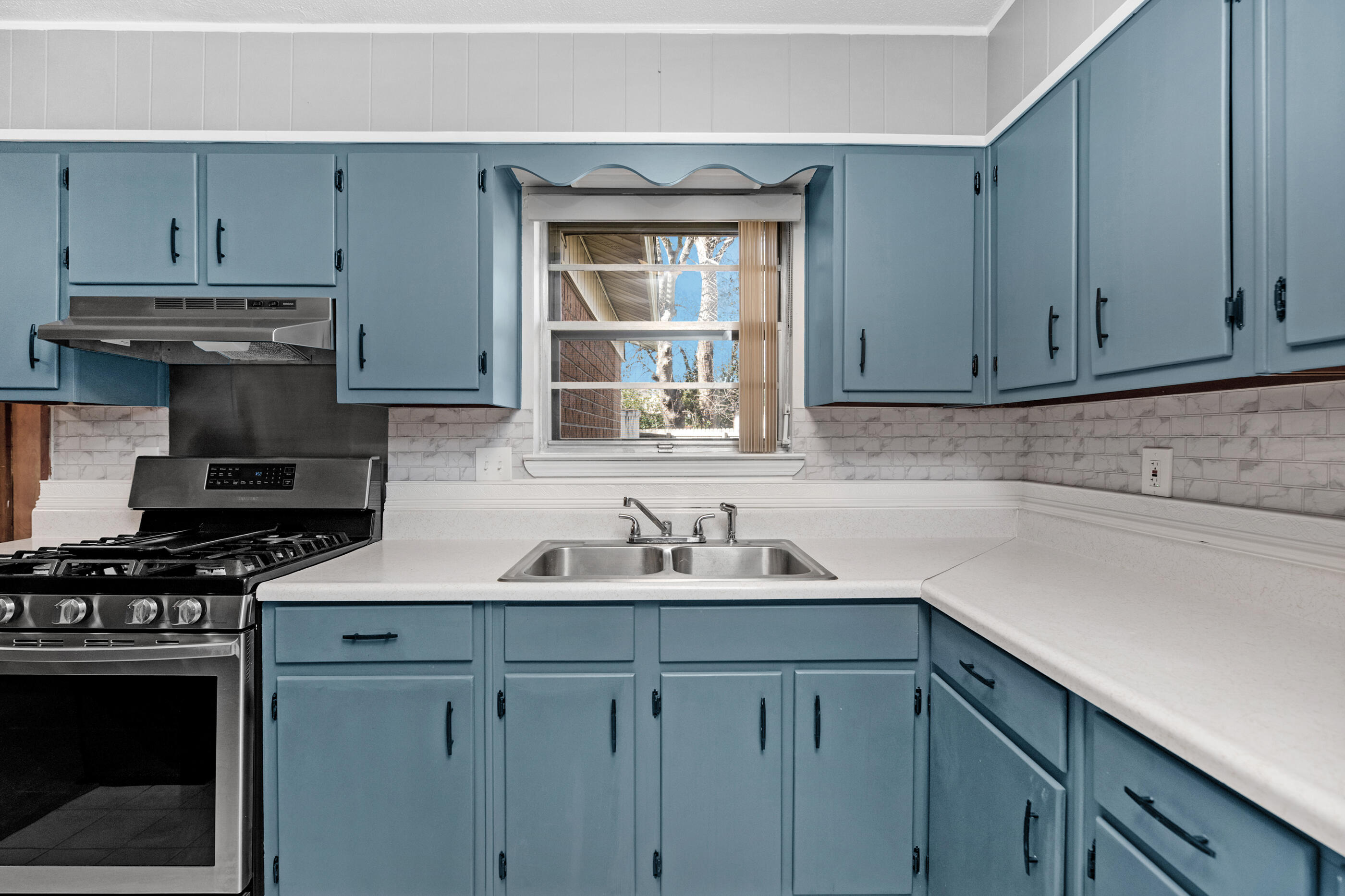 235 Deluna Road Southwest Fort Walton Beach, FL 32548 - Photo 2 of 29 a kitchen with stainless steel appliances granite countertop a sink stove and cabinets