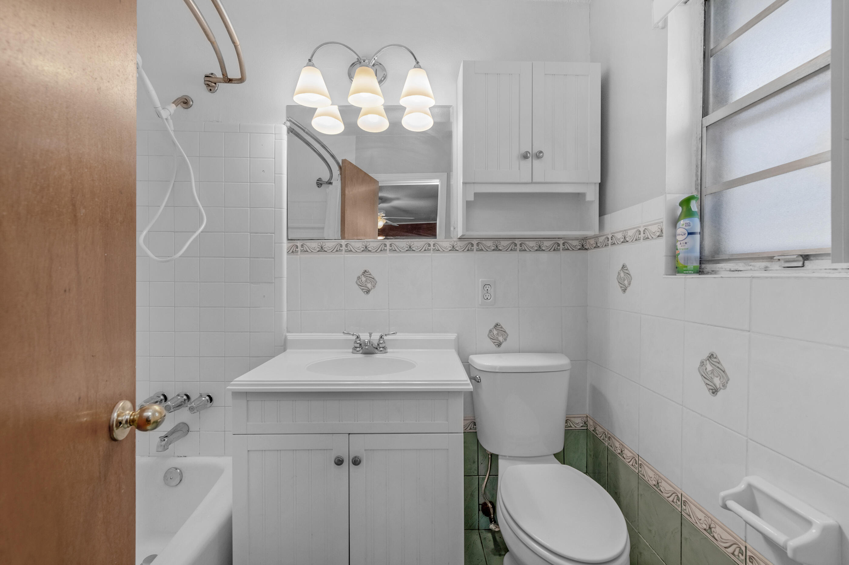 235 Deluna Road Southwest Fort Walton Beach, FL 32548 - Photo 23 of 29 a bathroom with a toilet a sink and mirror