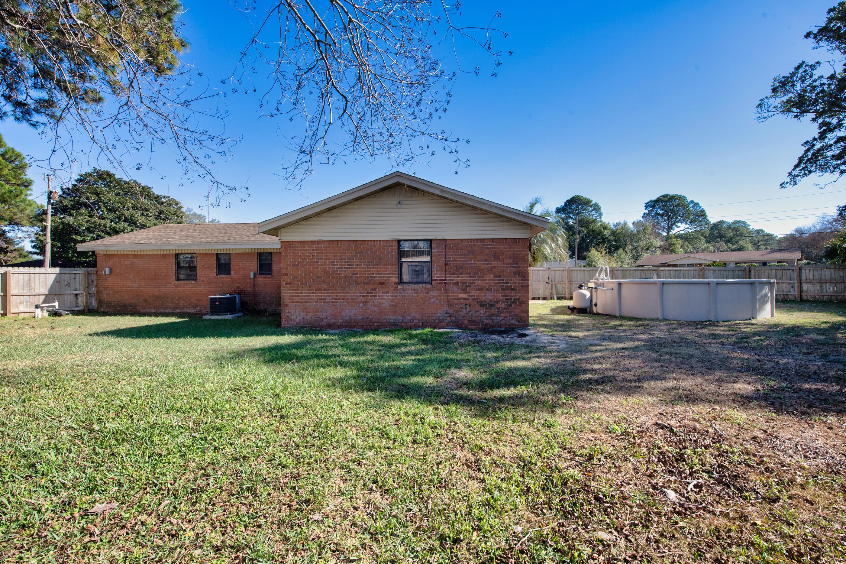 235 Deluna Road Southwest Fort Walton Beach, FL 32548 - Photo 26 of 29 a backyard of a house with lots of green space