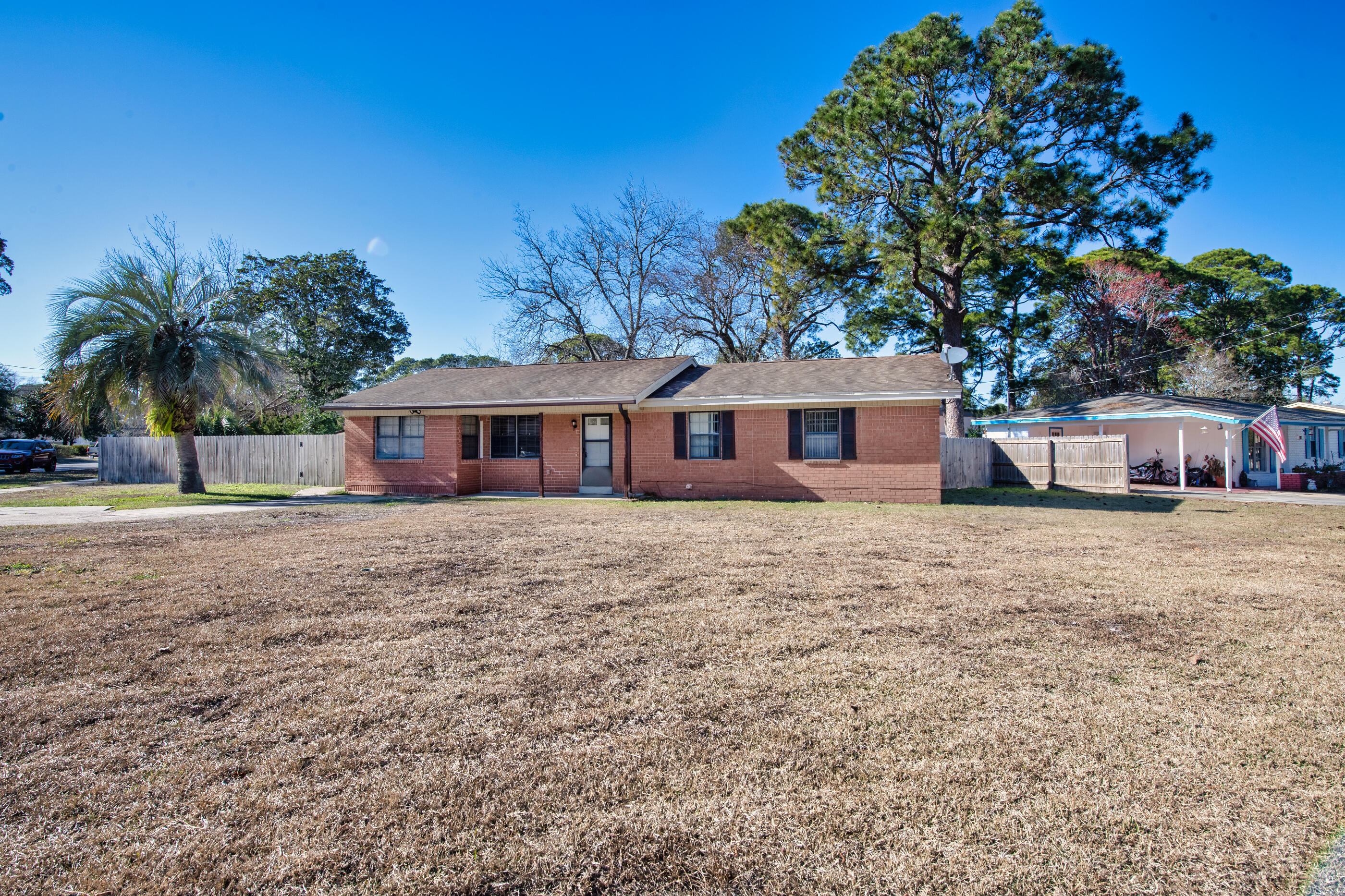 235 Deluna Road Southwest Fort Walton Beach, FL 32548 - Photo 28 of 29 a front view of house with yard and trees