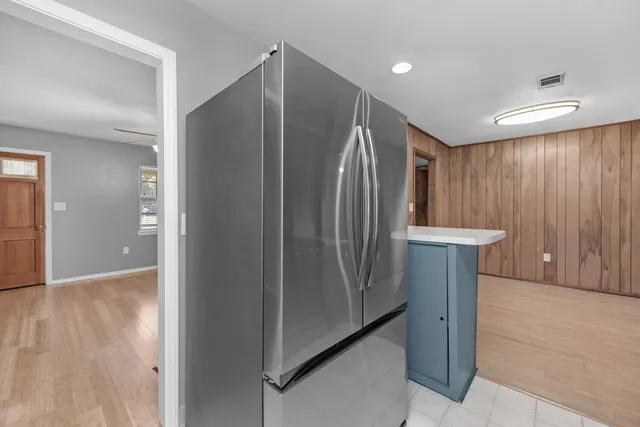 a view of a elevator with wooden door