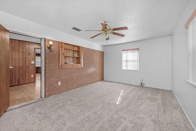 a view of an empty room with a window