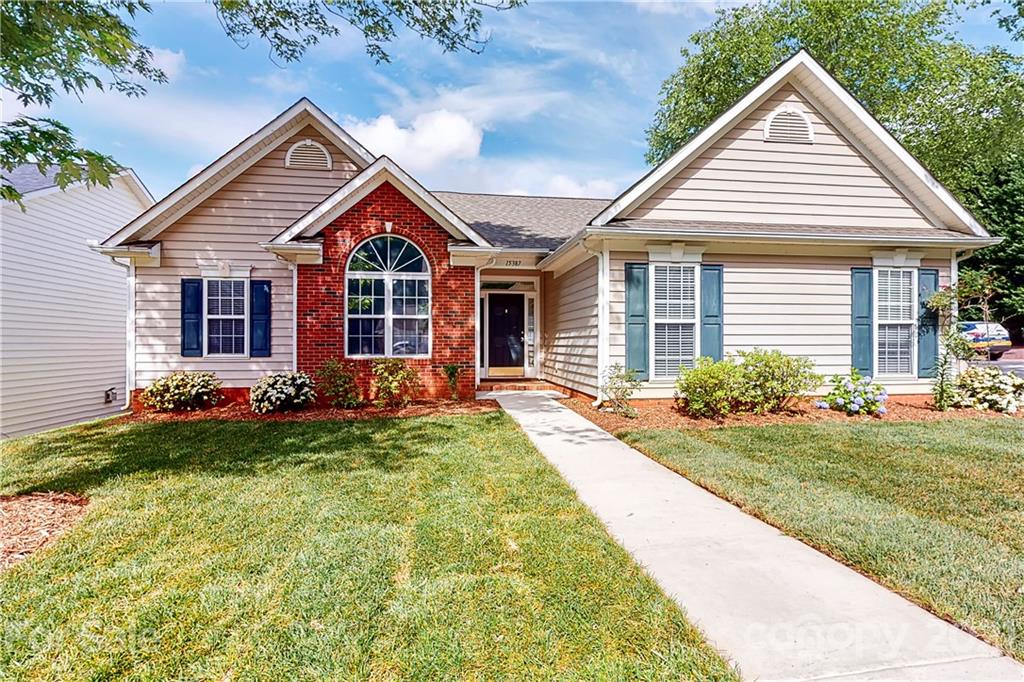 15387 Leslie Brooke Road Huntersville, NC 28078 - Photo 1 of 37 a front view of a house with garden