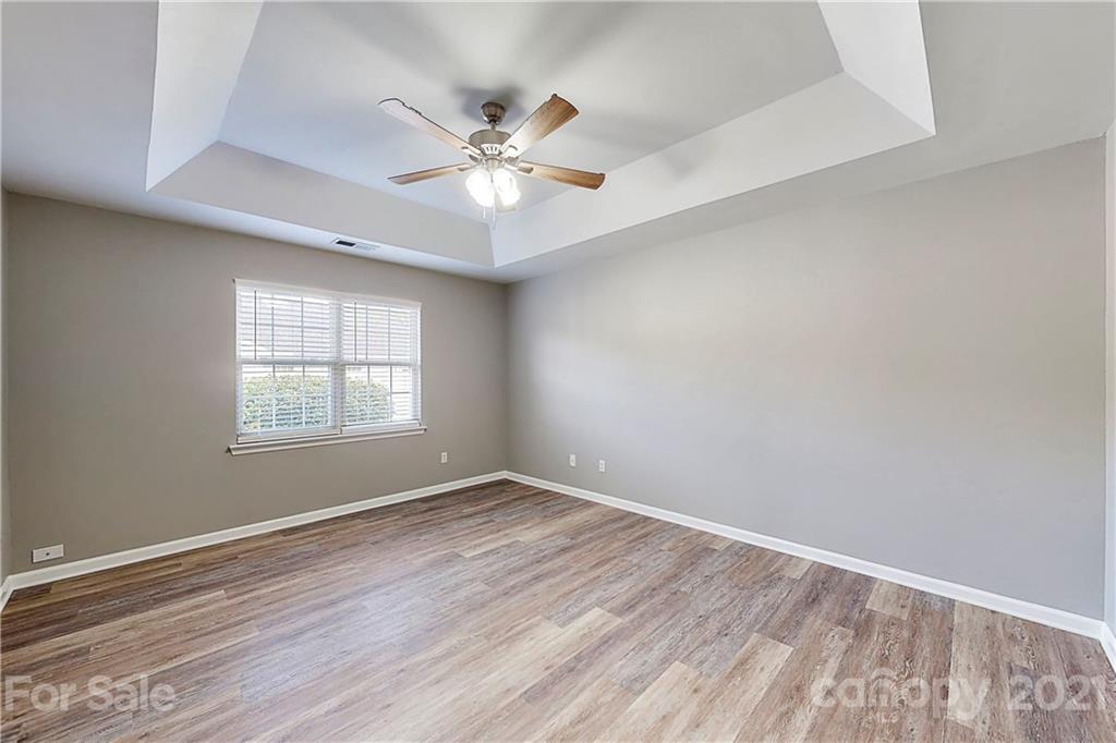 15387 Leslie Brooke Road Huntersville, NC 28078 - Photo 15 of 37 wooden floor in an empty room with a window