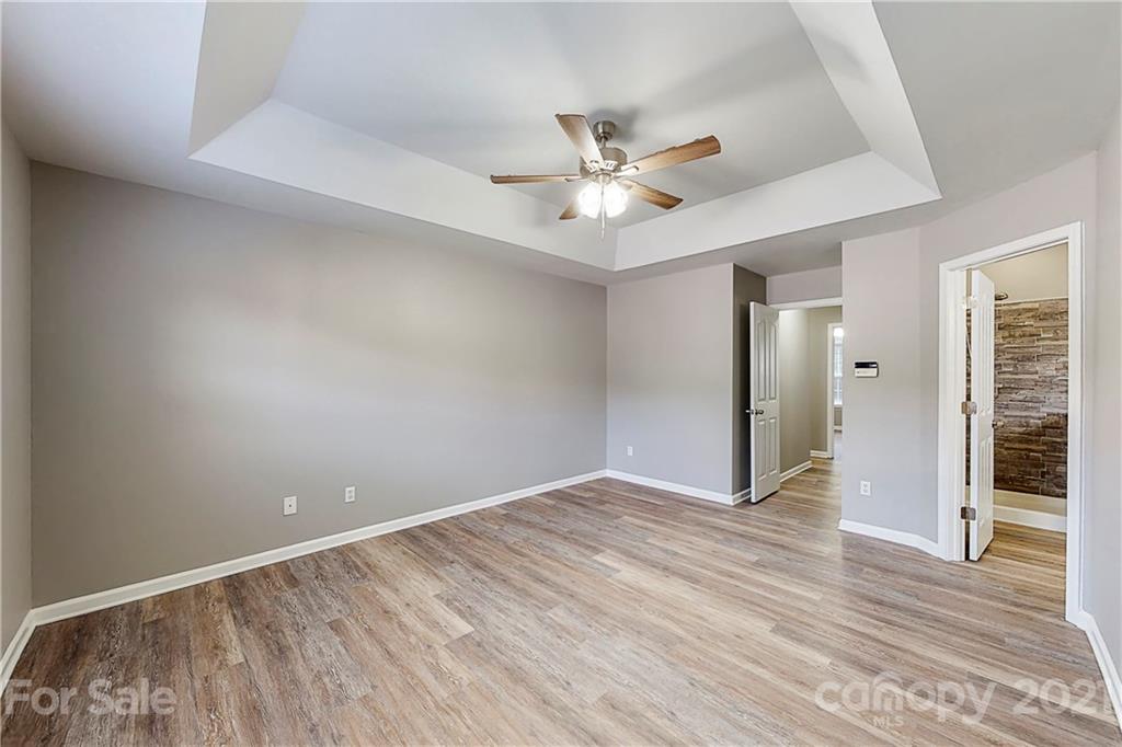 15387 Leslie Brooke Road Huntersville, NC 28078 - Photo 16 of 37 wooden floor in an empty room with a window