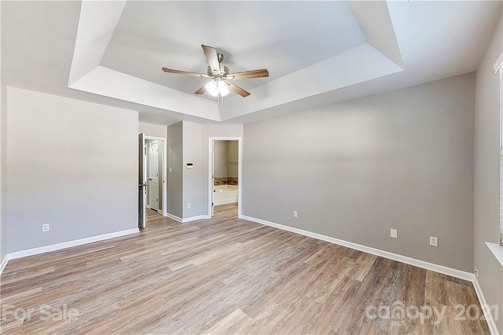 15387 Leslie Brooke Road Huntersville, NC 28078 - Photo 17 of 37 wooden floor in an empty room with a window