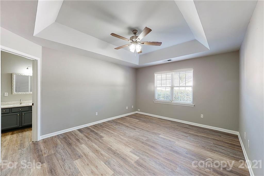 15387 Leslie Brooke Road Huntersville, NC 28078 - Photo 18 of 37 wooden floor in an empty room with a window