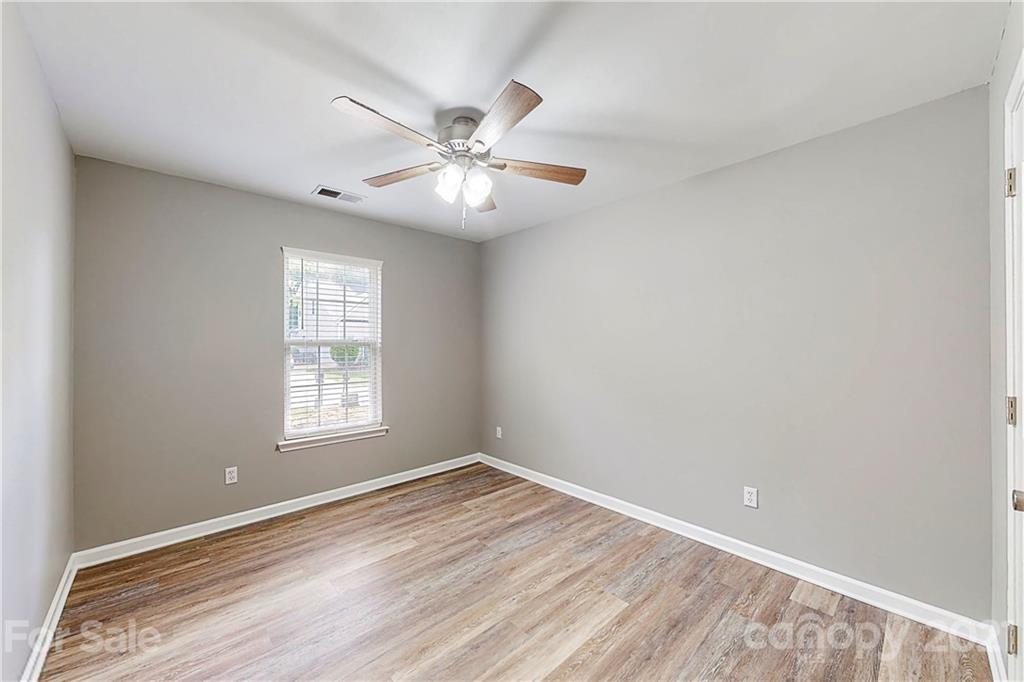 15387 Leslie Brooke Road Huntersville, NC 28078 - Photo 25 of 37 wooden floor in an empty room with a window