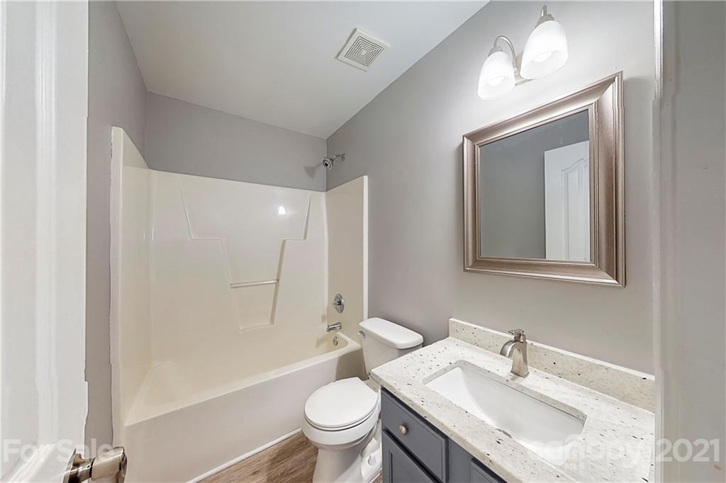 15387 Leslie Brooke Road Huntersville, NC 28078 - Photo 29 of 37 a bathroom with a sink toilet and shower