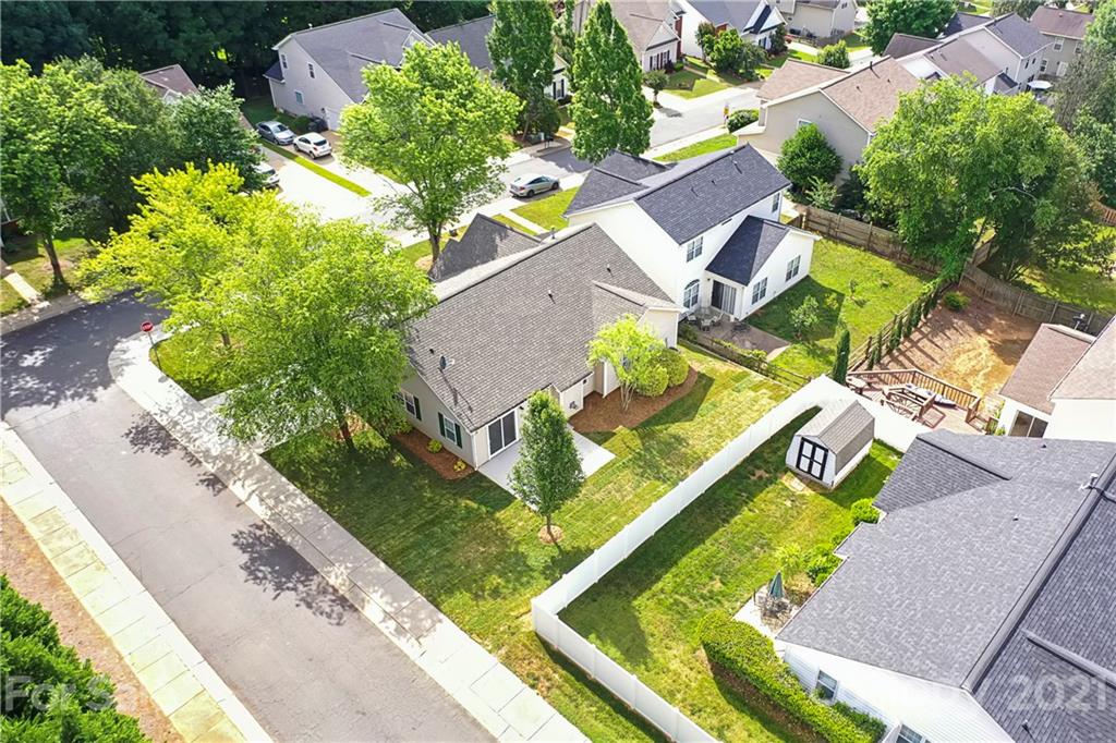 15387 Leslie Brooke Road Huntersville, NC 28078 - Photo 33 of 37 an aerial view of a house with a garden and swimming pool