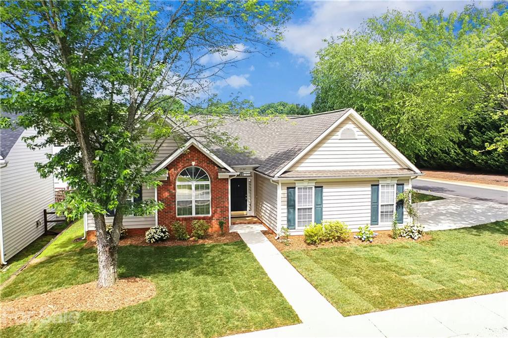 15387 Leslie Brooke Road Huntersville, NC 28078 - Photo 37 of 37 a view of a yard in front of a house with large trees