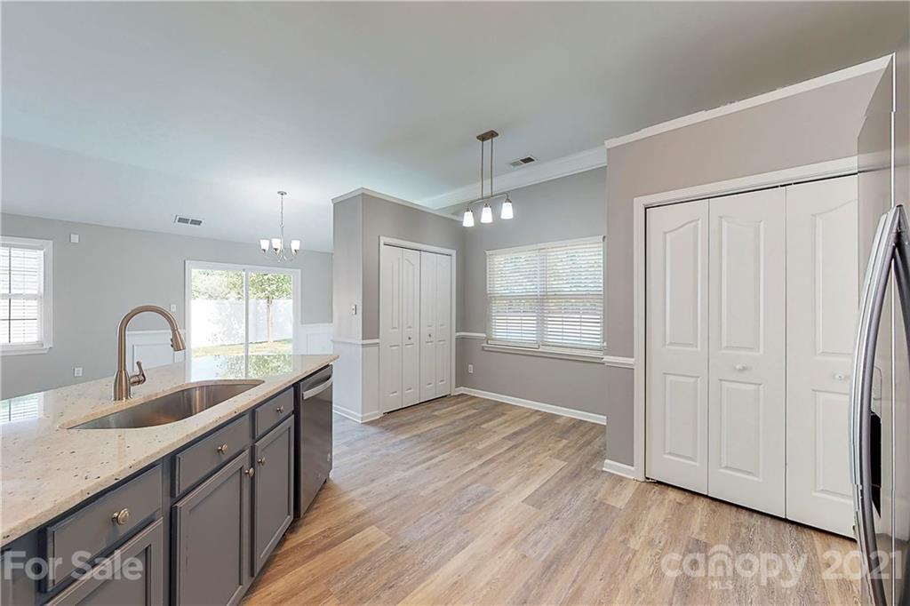 15387 Leslie Brooke Road Huntersville, NC 28078 - Photo 10 of 37 a spacious bathroom with a double vanity sink a mirror and shower